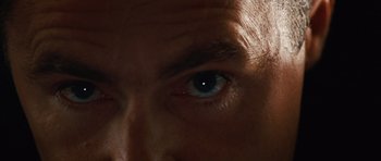 Movie still from “Wanted” (2008), directed by Timur Bekmambetov – A man's eye with a black spot in it; Extreme Close Up shot, Overhead angle