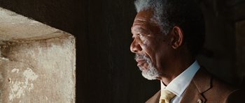 Movie still from “Wanted” (2008), directed by Timur Bekmambetov – An older man wearing a yellow neck tie looking into the distance; Close Up shot, Low angle
