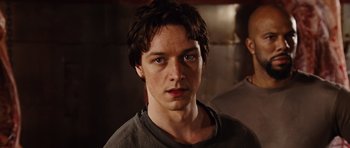 Movie still from “Wanted” (2008), directed by Timur Bekmambetov – A person wearing a shirt; Close Up shot, Low angle