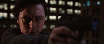 Movie still from “Wanted” (2008), directed by Timur Bekmambetov – A person using a cell phone; Close Up shot, Low angle