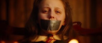 Movie still from “Wanted” (2008), directed by Timur Bekmambetov – A girl with duct tape over her mouth; Close Up shot, Low angle