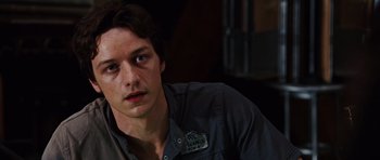 Movie still from “Wanted” (2008), directed by Timur Bekmambetov – A young man sitting in front of a window; Close Up shot, Over the shoulder angle