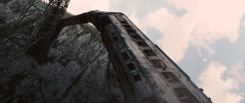 Movie still from “Wanted” (2008), directed by Timur Bekmambetov – A view of the side of a roller coaster; Extreme Wide shot, Overhead angle