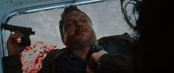 Movie still from “Wanted” (2008), directed by Timur Bekmambetov – A person with blood on his face; Close Up shot, Overhead angle