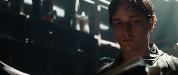 Movie still from “Wanted” (2008), directed by Timur Bekmambetov – A person wearing a leather jacket; Close Up shot, Low angle