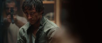 Movie still from “Wanted” (2008), directed by Timur Bekmambetov – A person wearing a leather jacket; Close Up shot, Over the shoulder angle