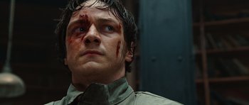 Movie still from “Wanted” (2008), directed by Timur Bekmambetov – A person with blood on his face; Close Up shot, Low angle
