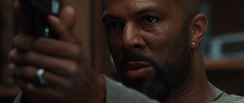 Movie still from “Wanted” (2008), directed by Timur Bekmambetov – A person with a beard; Extreme Close Up shot, Low angle