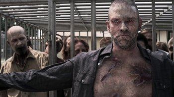 Movie still from “Z Nation” (2014), created by Karl Schaefer – A man with a bunch of blood all over his body; Medium shot, Low angle