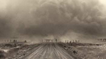 Movie still from “Z Nation” (2014), created by Karl Schaefer – A black and white photo of a dirt road; Extreme Wide shot, Low angle