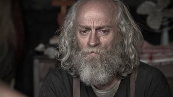 Movie still from “Z Nation” (2014), created by Karl Schaefer – An old man with a long white beard; Close Up shot, Over the shoulder angle