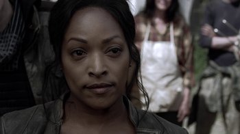Movie still from “Z Nation” (2014), created by Karl Schaefer – A woman in a brown jacket and a woman in an apron; Close Up shot, Over the shoulder angle