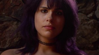 Movie still from “Creep 2” (2017), directed by Patrick Brice – A person with purple hair; Close Up shot, Low angle