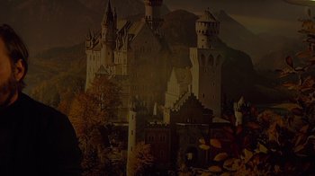 Movie still from “Creep 2” (2017), directed by Patrick Brice – A picture of a castle in the middle of a forest; Medium shot, Low angle