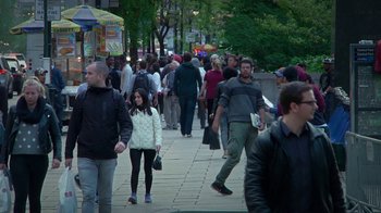Movie still from “Creep 2” (2017), directed by Patrick Brice – A crowd of people walking down a sidewalk; Wide shot, High angle