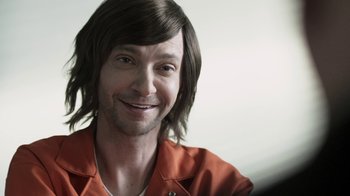 Movie still from “Z Nation” (2014), created by Karl Schaefer – A person with long brown hair; Close Up shot, Over the shoulder angle
