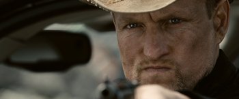 Movie still from “Zombieland” (2009), directed by Ruben Fleischer – A person wearing a cowboy hat; Close Up shot, Over the shoulder angle
