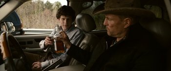 Movie still from “Zombieland” (2009), directed by Ruben Fleischer – Two men sitting in the back seat of a car; Medium shot, Over the shoulder angle