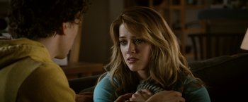 Movie still from “Zombieland” (2009), directed by Ruben Fleischer – A woman sitting on a couch with another woman; Close Up shot, Over the shoulder angle