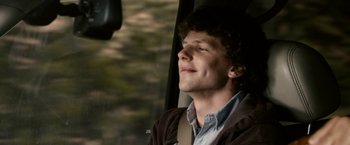 Movie still from “Zombieland” (2009), directed by Ruben Fleischer – A man sitting in a car looking out the window; Close Up shot, Over the shoulder angle