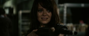 Movie still from “Zombieland” (2009), directed by Ruben Fleischer – A woman crying while holding a cell phone in her hands; Close Up shot, Over the shoulder angle