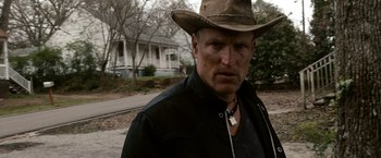 Movie still from “Zombieland” (2009), directed by Ruben Fleischer – A person wearing a cowboy hat; Close Up shot, Over the shoulder angle