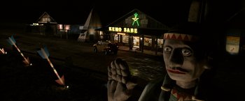 Movie still from “Zombieland” (2009), directed by Ruben Fleischer – A statue of a person in front of a building; Wide shot, Low angle