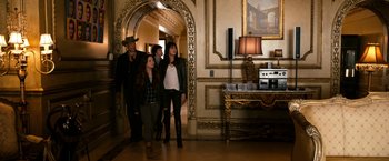 Movie still from “Zombieland” (2009), directed by Ruben Fleischer – A group of people walking through a hallway; Wide shot, Over the shoulder angle