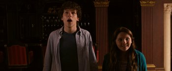 Movie still from “Zombieland” (2009), directed by Ruben Fleischer – A young man and a young woman standing next to each other; Medium shot, Low angle