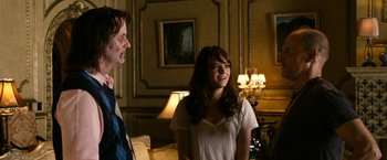 Movie still from “Zombieland” (2009), directed by Ruben Fleischer – A man and a woman standing next to each other in a room; Medium shot, Over the shoulder angle