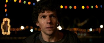 Movie still from “Zombieland” (2009), directed by Ruben Fleischer – A person with curly hair; Close Up shot, Over the shoulder angle