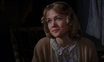 Movie still from “10 Rillington Place” (1971), directed by Richard Fleischer – A woman with blonde hair wearing a floral shirt; Close Up shot, Over the shoulder angle