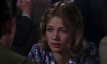 Movie still from “10 Rillington Place” (1971), directed by Richard Fleischer – A person wearing a floral shirt; Close Up shot, Over the shoulder angle