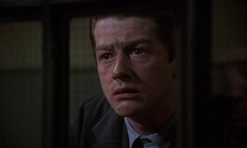 Movie still from “10 Rillington Place” (1971), directed by Richard Fleischer – A person wearing a suit and tie; Close Up shot, Low angle