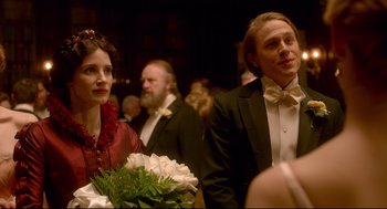 Movie still from “Crimson Peak” (2015), directed by Guillermo del Toro – A man and a woman standing next to each other holding flowers; Close Up shot, Over the shoulder angle