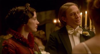 Movie still from “Crimson Peak” (2015), directed by Guillermo del Toro – A man and a woman dressed in formal wear; Close Up shot, Over the shoulder angle