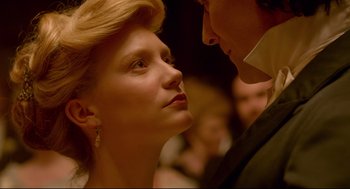 Movie still from “Crimson Peak” (2015), directed by Guillermo del Toro – A man and a woman looking into each others eyes; Close Up shot, Low angle