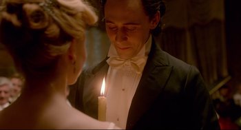 Movie still from “Crimson Peak” (2015), directed by Guillermo del Toro – A man and a woman holding a lit candle in front of him; Close Up shot, Over the shoulder angle