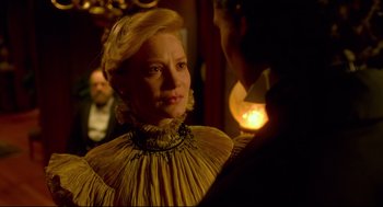 Movie still from “Crimson Peak” (2015), directed by Guillermo del Toro – A woman in a yellow dress looking at a man in a black suit; Close Up shot, Over the shoulder angle