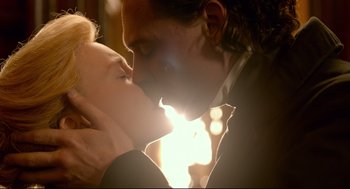 Movie still from “Crimson Peak” (2015), directed by Guillermo del Toro – A man and a woman are kissing in the sunlight; Close Up shot, Low angle
