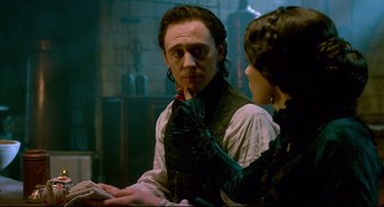 Movie still from “Crimson Peak” (2015), directed by Guillermo del Toro – A man and a woman looking at each other in front of a bathroom mirror; Close Up shot, Over the shoulder angle