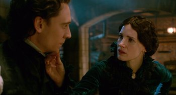 Movie still from “Crimson Peak” (2015), directed by Guillermo del Toro – A man and a woman looking at one another; Close Up shot, Over the shoulder angle