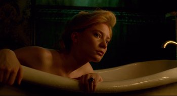 Movie still from “Crimson Peak” (2015), directed by Guillermo del Toro – A woman sitting in a bath tub in the dark; Close Up shot, High angle