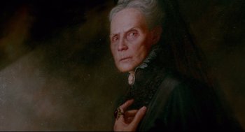Movie still from “Crimson Peak” (2015), directed by Guillermo del Toro – An old woman with a black dress and white hair; Close Up shot, Low angle