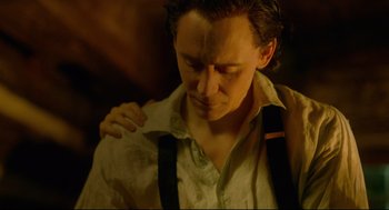 Movie still from “Crimson Peak” (2015), directed by Guillermo del Toro – A person wearing a shirt and suspenders; Close Up shot, Low angle