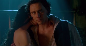 Movie still from “Crimson Peak” (2015), directed by Guillermo del Toro – A person with his arm around a woman; Close Up shot, Over the shoulder angle