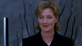 Movie still from “101 Dalmatians” (1996), directed by Stephen Herek – A person wearing a suit; Close Up shot, Low angle