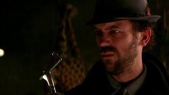 Movie still from “101 Dalmatians” (1996), directed by Stephen Herek – A person wearing a hat; Close Up shot, Low angle