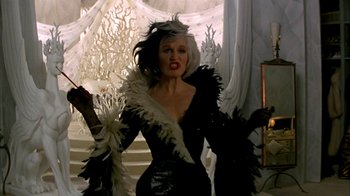 Movie still from “101 Dalmatians” (1996), directed by Stephen Herek – A woman in a black and white dress with white feathers; Medium shot, Low angle