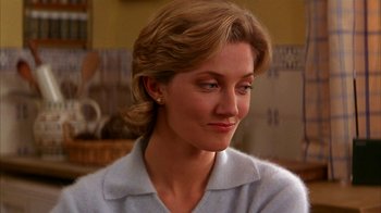 Movie still from “101 Dalmatians” (1996), directed by Stephen Herek – A person wearing a white shirt; Close Up shot, Over the shoulder angle